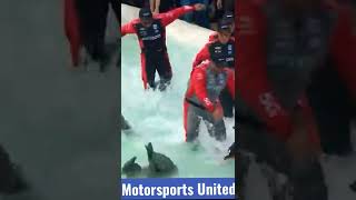 Will Power swims in the victory fountain at Belle Isle