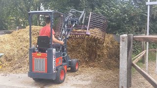 Purple Packer with Intrepid loader - cleaning out horse stalls FAST