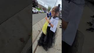 Race cars and demo derby cars in a Halloween parade.