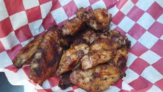 Weber SmokeFire Peri-Peri wings and rising crust pizza.