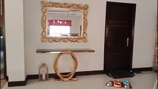 Steel gold console along with mirror