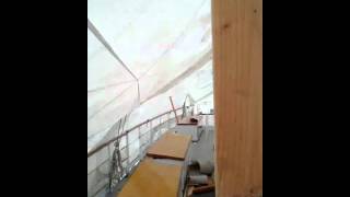 Knocking Ice off the Schooner SoundWaters Cover after the 2011 Groundhog Day Ice Storm