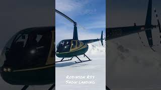 Robinson R44 helicopter landing on a snow covered mountain #helicopter #flying #snow #howtobeapilot