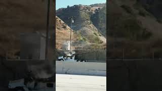 CA-91 Corona CA: Truck fire started a small fire on the hillside.