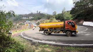 Truck and busses in sharp curve ghat road Uturn