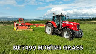 Massey Ferguson 7499 mowing grass with the Pottinger Trailed