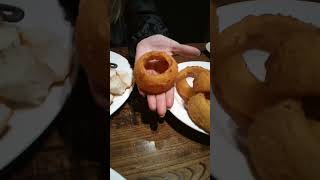 Onion rings are huge!  onion not cooked. cheese fondue at  local goat,grainy and no flavor.