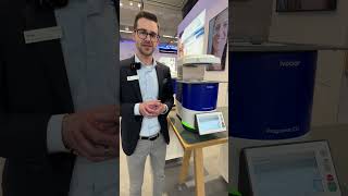 Michael Tiefenthaler, global product manager Ivoclar at IDS2023 shows Programat CS6 to Team Ivodent