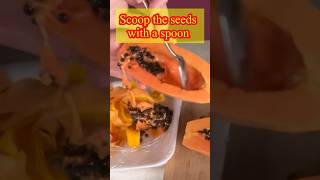 Scoop the seeds of papaya using spoon#shorts