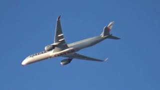 Qatar Airways Airbus A350-1041 flying past as QR1