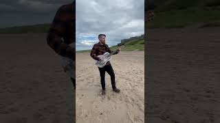 Playing my new song out in the wild the other day at Bamburgh Castle, moving here soon