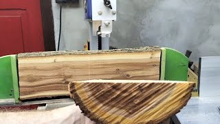 Cutting a log of plum wood on the bandsaw