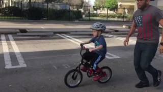 Elijah rides his bike