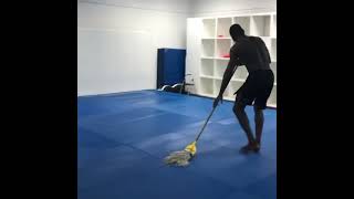 Israel Adesanya washes the floor the gym