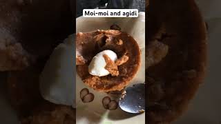 Eating moi-moi (Beans cake) and agidi