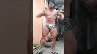 Asian muscle bull flexing and posing in colorful underwear