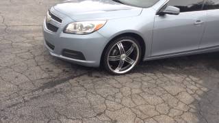 Chevy Malibu on 20"s leaving RIMTYME Stone a mountain.