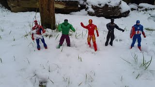 SUPERHEROES PLAYING IN THE SNOW AND A SNOW BALL FIGHT