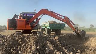 Excavator Loading Trucks