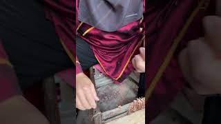 Craftsmen making spinning tops using traditional techniques