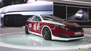 Race cars on display at the Detroit Auto Show