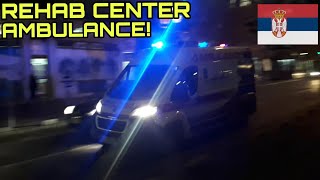 Ambulance of the Rehabilitation Center with Lights