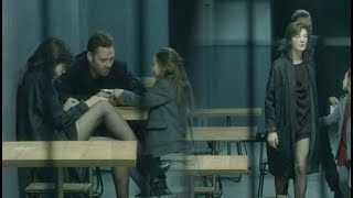 Charlotte Gainsbourg sitting in a black miniskirt with black pantyhose - 2011 movie Dark Crimes