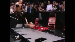 Kane suplexes Shawn Michaels through table