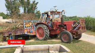 Russi tractor drag a fully loaded tree is beauti wooden trolley having great performance 👏 👌👍 .