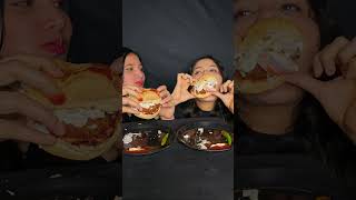 Chicken burger eating challenge by sisters #shortvideo #asmr #mukbang #burger #challenges