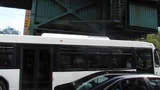 Unmarked shuttle bus at Broadway and West 124th Street