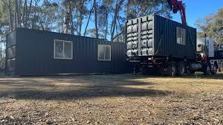 Container Solutions Unloading and Assembling a Container Home on site.