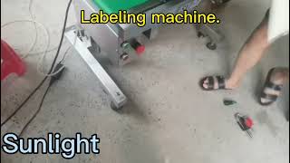 Labeling machine. Could label on top and at the bottom at the same time.