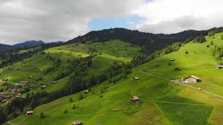 Alpine Elegance: 4K Aerial Views of a Village Nestled in the Swiss Mountains 🏔️🚁