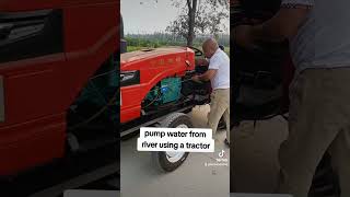 Pump water from a river using a tractor.