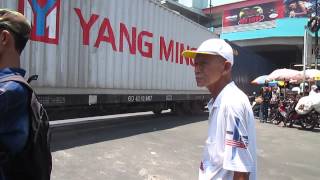 Indonesian railways : container train 10061 at pasarturi