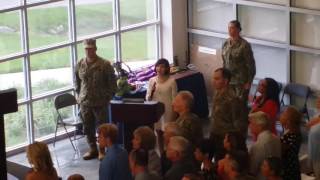 Elizabeth Hughes, 14, sings national anthem at SEAL Change of Command in Norfolk.