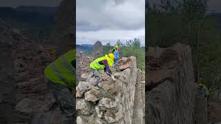 Masons use stones for reinforcement to prevent landslides