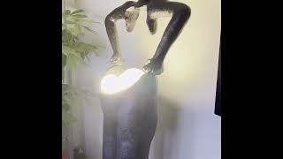 Man Carrying Pants Statue Floor Lamp