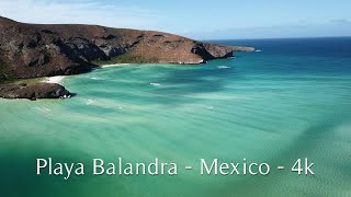 Experience the Magic of Playa Balandra Flying Over the Vibrant Hues of Blue and Green Waters