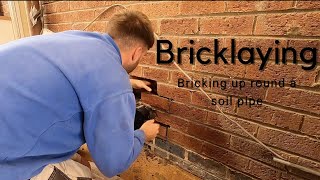 Bricklaying- Bricking up round a soil pipe