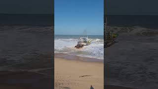 Launching a Fishing Boat amidst strong waves