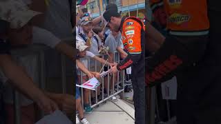 Chase Elliott signing autographs for fans in Miami