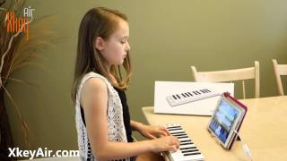 Kids play Xkey with PianoMaestro on iPad