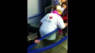 Drunk woman falls at top of escalator Hampden Park