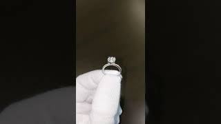 1.52ct round brilliant diamond in a platinum engagement ring with micro pave set accent diamonds