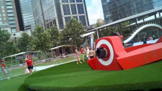 Kids running around in a giant sprinkler