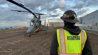 HVAC rooftop equipment lift with a helicopter