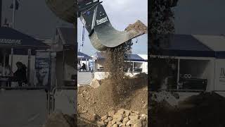 Excavator with Dappen hydraulic screening attachment at Bauma construction and mining exhibition.