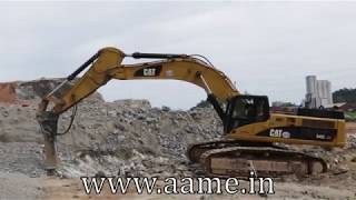 Caterpillar 345C L Excavator With A Hydraulic Hammer Breaking Rocks